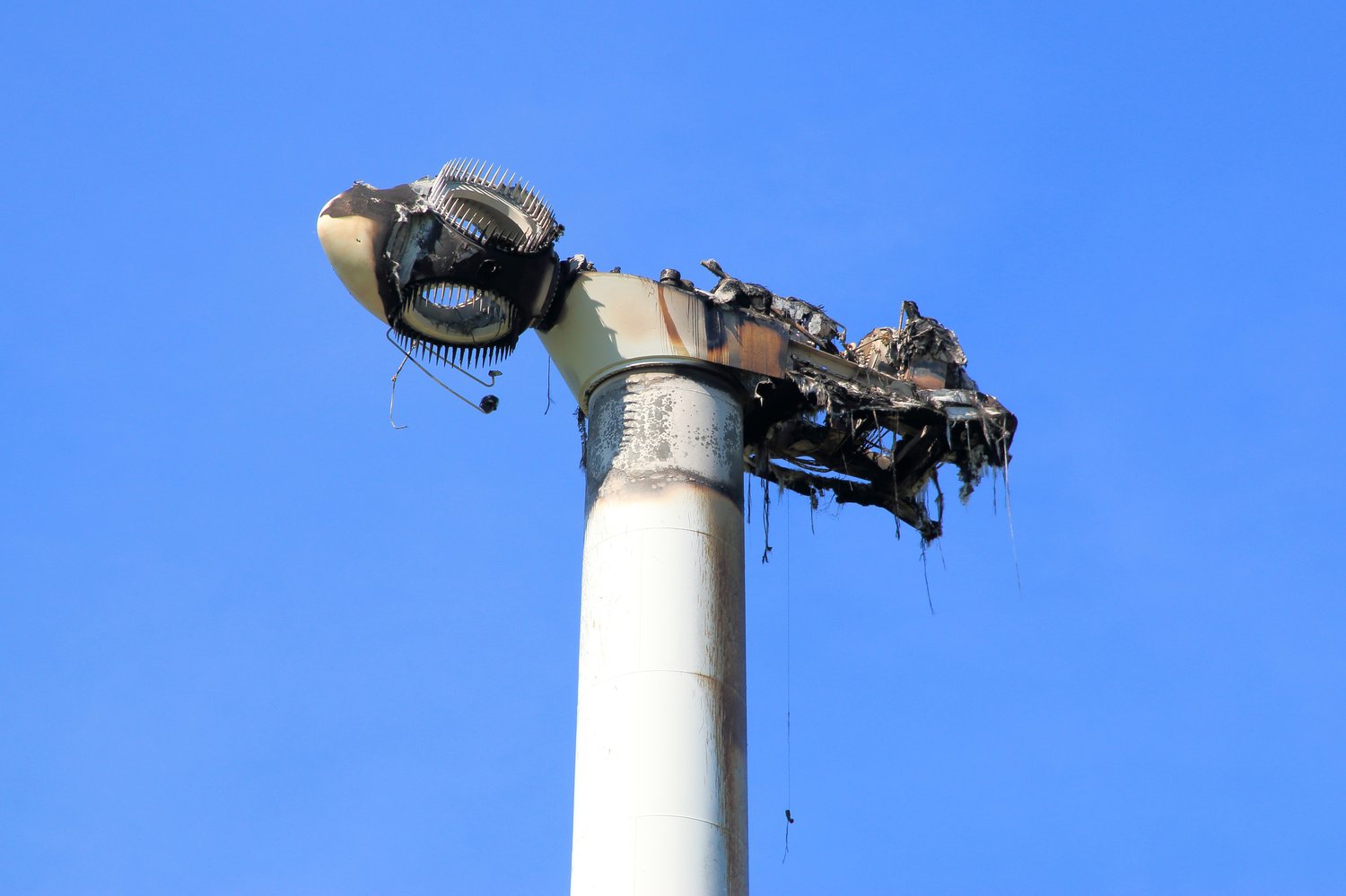 burned windmill, destroyed nacelle by fire-Shutterstock_ 1231008466